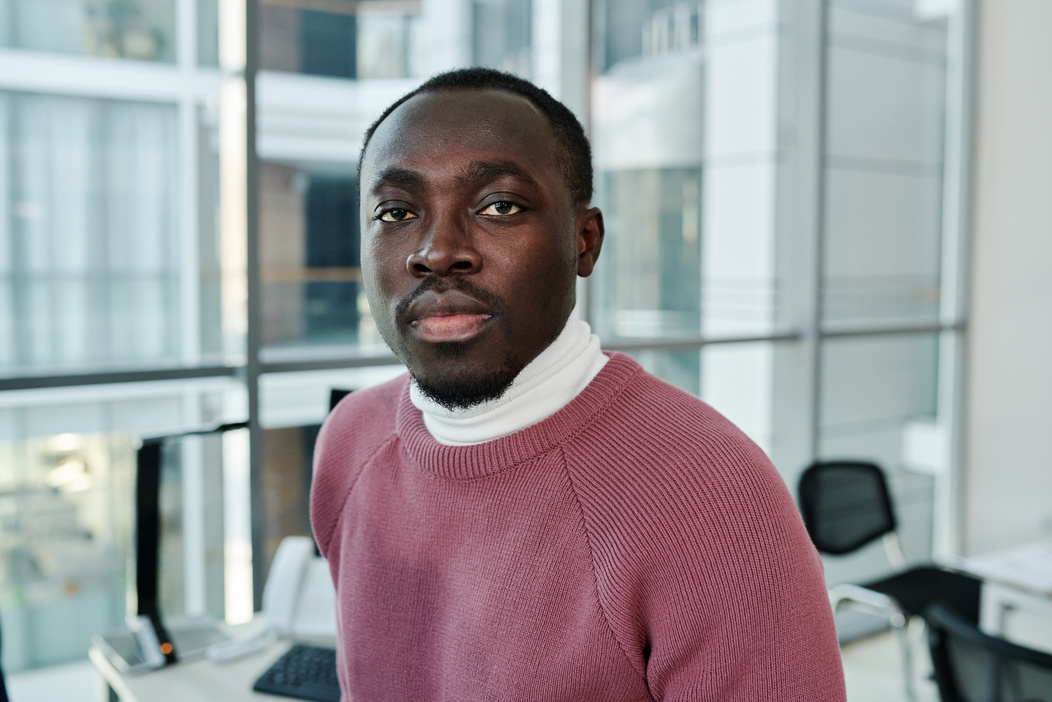 Close-Up Shot of a Man in Maroon Sweater